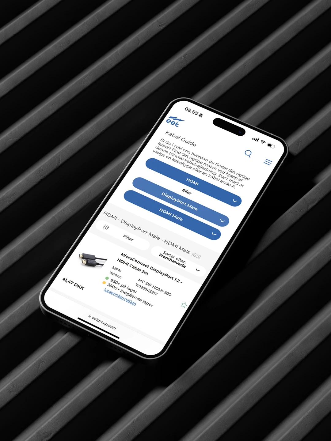 Smartphone displaying a cable guide webpage with options for HDMI and DisplayPort connections, placed on a textured black surface.