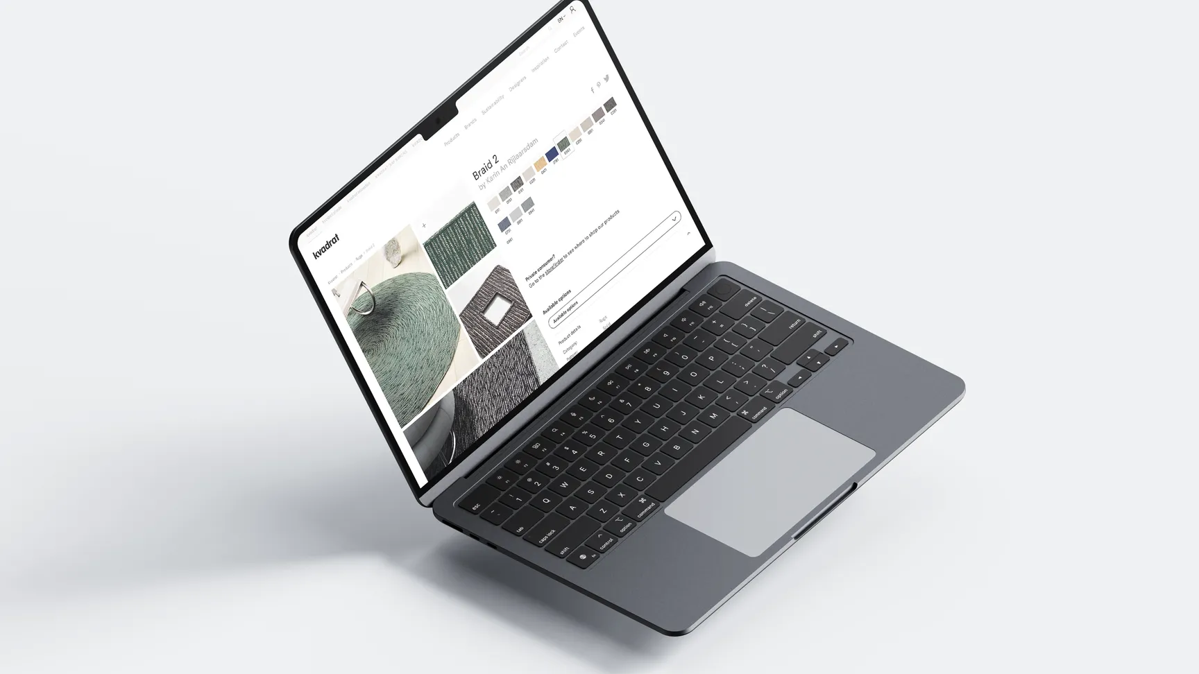 Billede af en bærbar computer, der viser en farvepalet og teksturer på en skærm med en lys baggrund, der fremhæver designmuligheder.