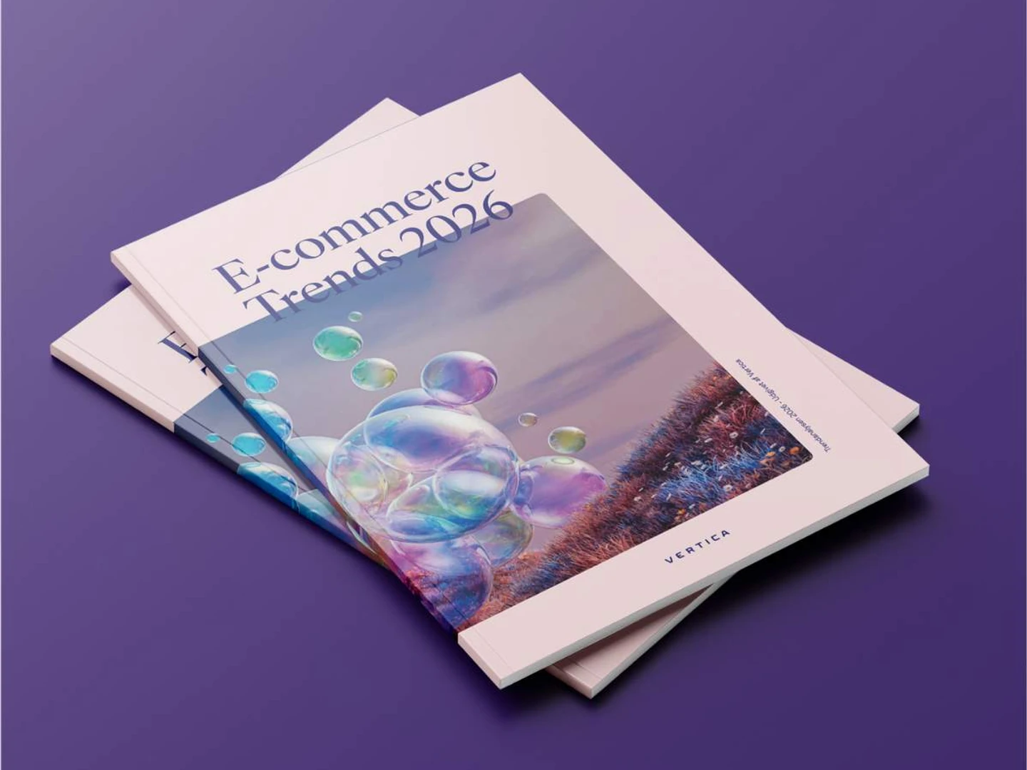 E-commerce Trends 2025 report covers emerging trends in online shopping, displayed on a light wooden surface with visually appealing design elements.