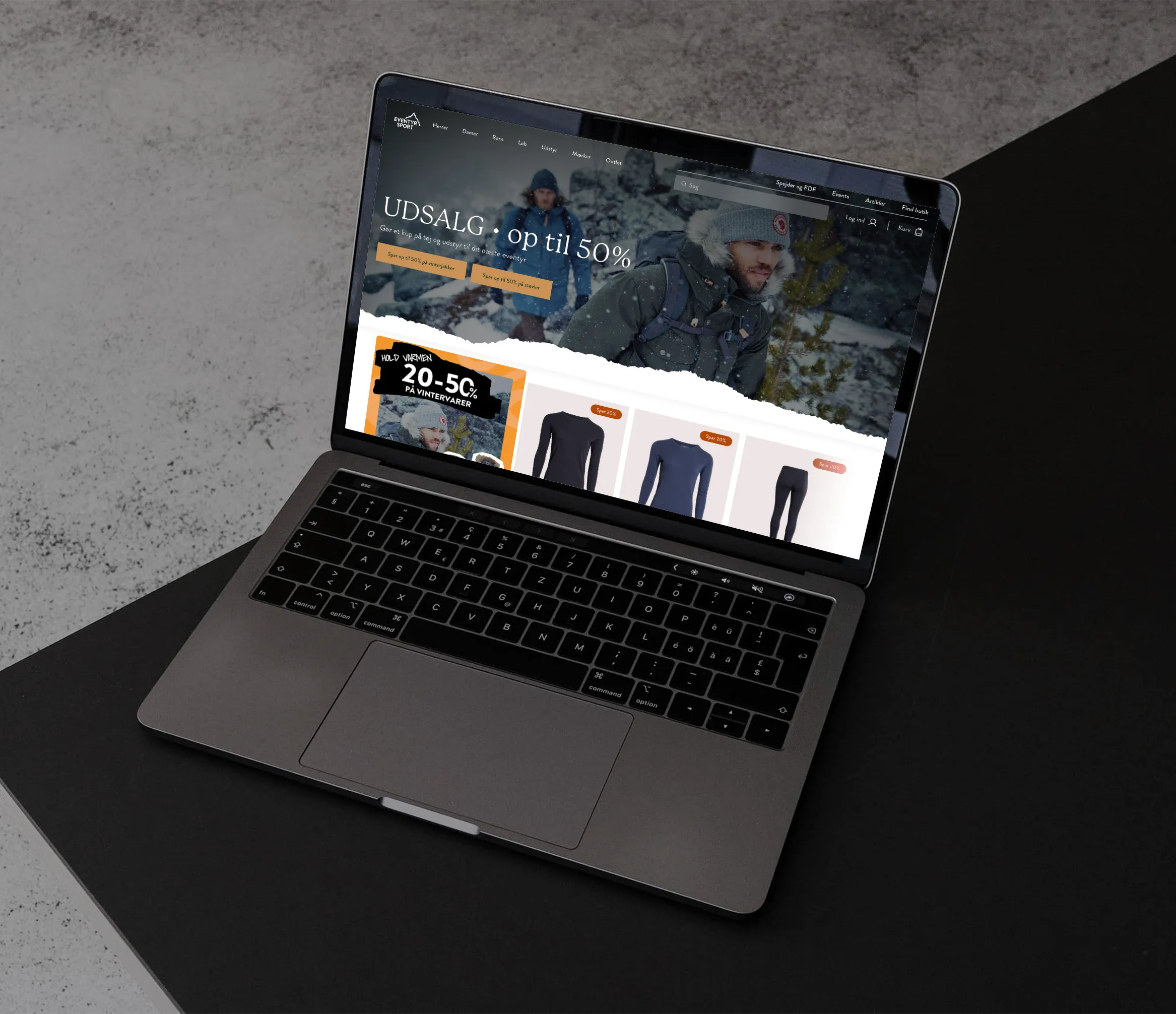 Billede af en bærbar computer, der viser Eventyrsports webshop.