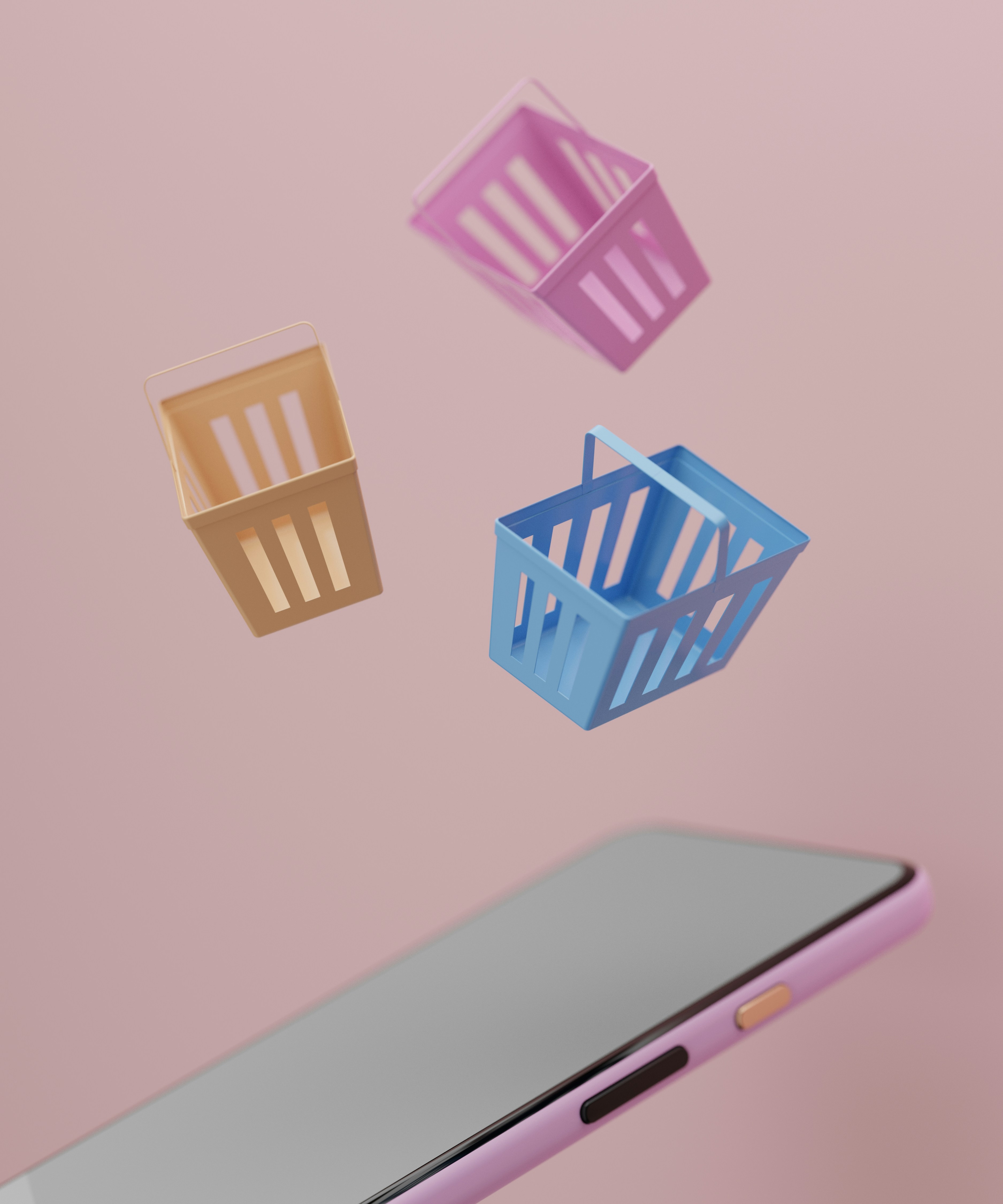To små indkøbskurve svæver over en smartphone på en lyserød baggrund, symboliserer online shopping og digital handel.