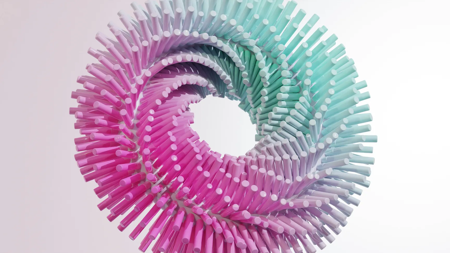 Farverig spiral formet skulptur lavet af cylindriske elementer i nuancer af pink og mintgrøn, set mod en hvid baggrund.