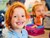 Barn med manglende fortand smiler til kameraet fra Coops B2C ecommerce løsning til app og web